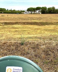 a frisbee is in the middle of a field