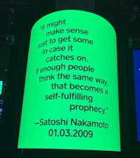 a green screen with a quote from satoshi nakamura